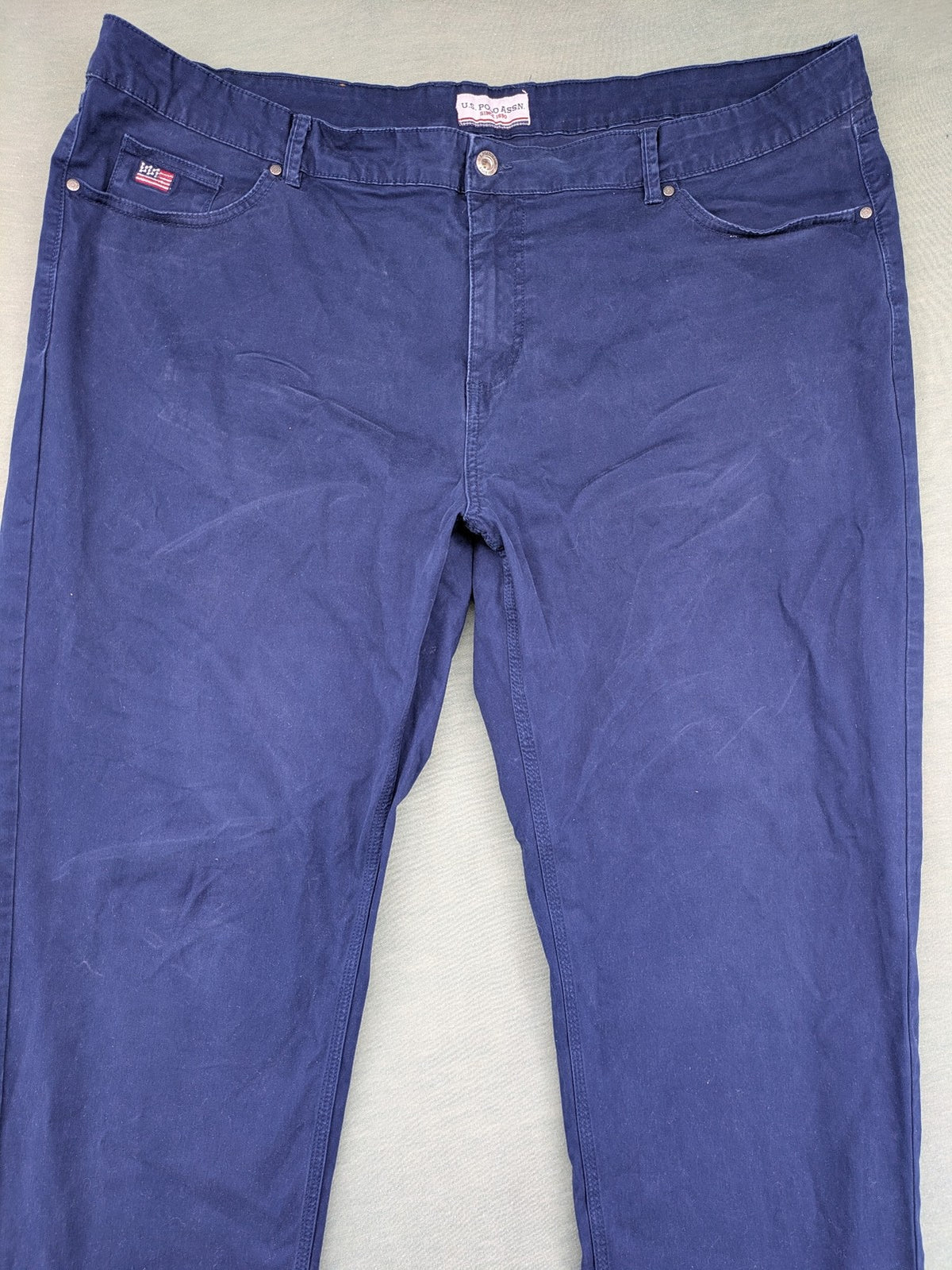 U.S. Polo Assn. navy chino pants classic 5-pocket design with subtle logo stitching