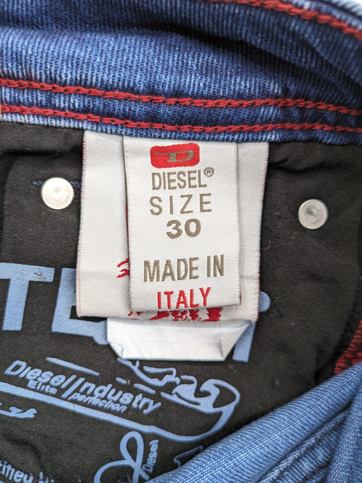 Diesel blue straight jeans with distressed details and ripped accents, made of cotton.