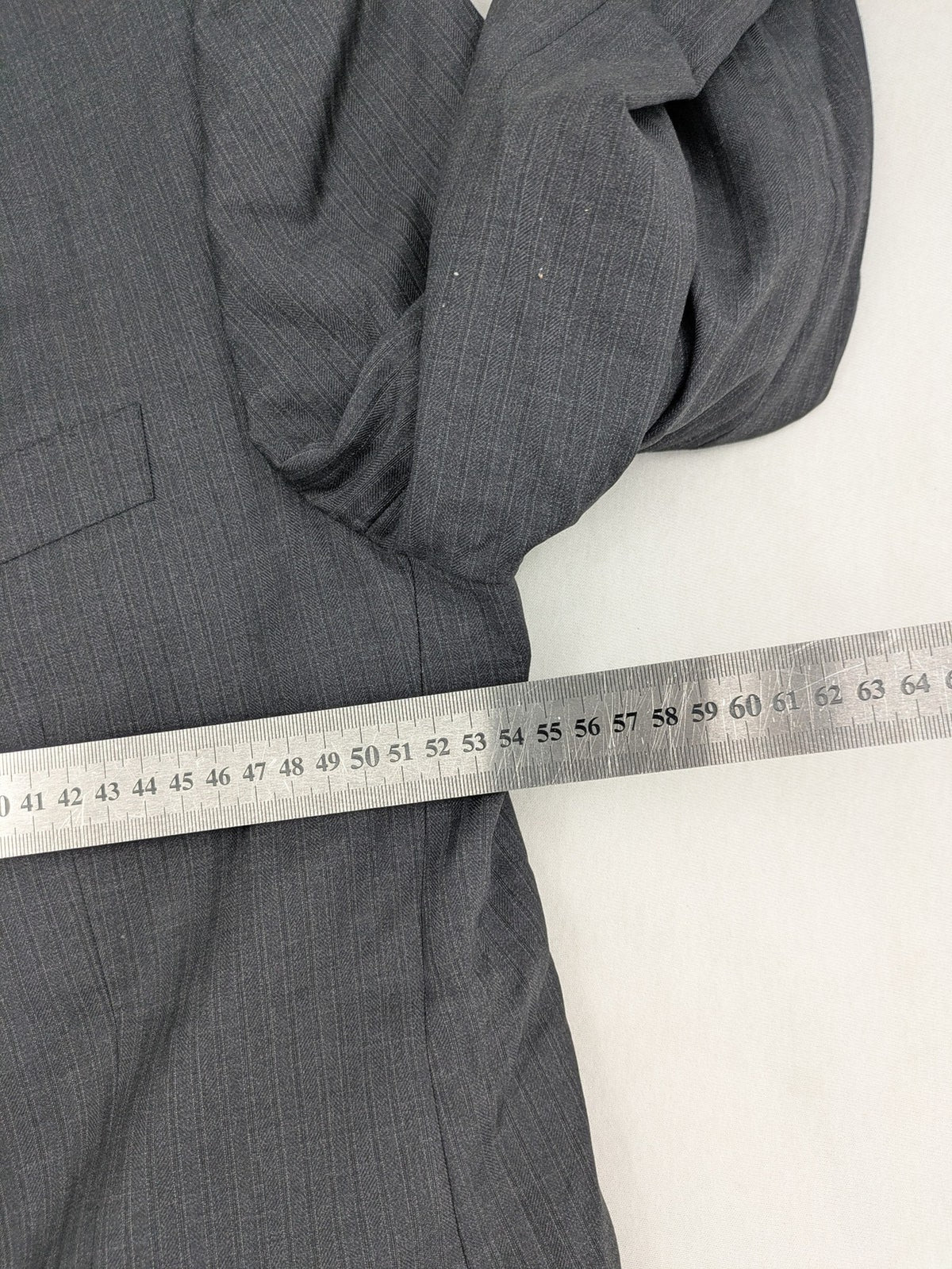 Desch grey blazer with dark grey pinstripe pattern, satin lining, and tailored design.