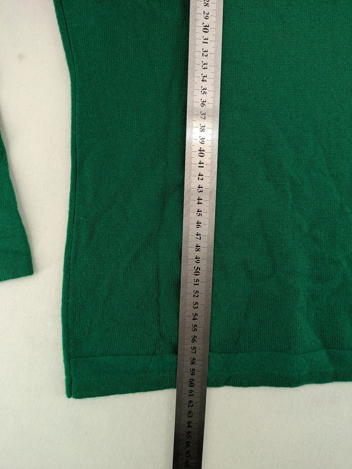 Pullover green cashmere turtle neck jumper with classic V-neck and long sleeves.