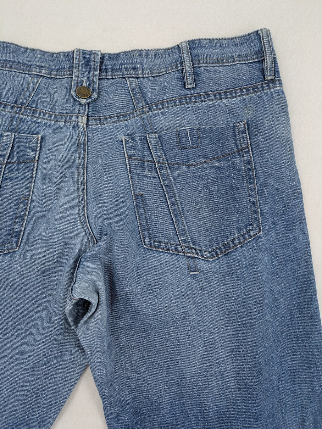C&A blue straight jeans 5-pocket style with logo and button closure.