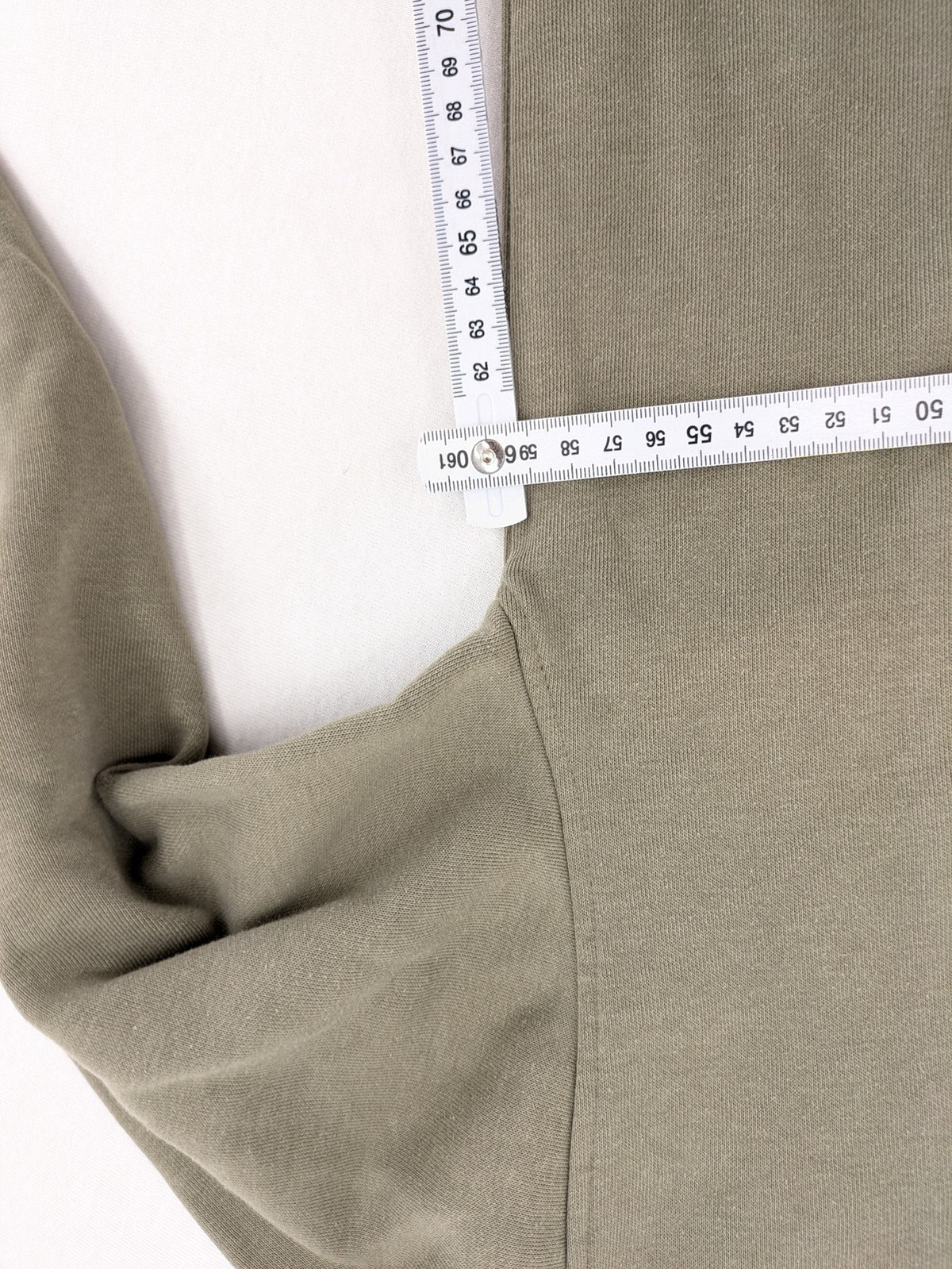 Naruto khaki turtle neck jumper featuring red Akatsuki cloud and Sharingan symbols.