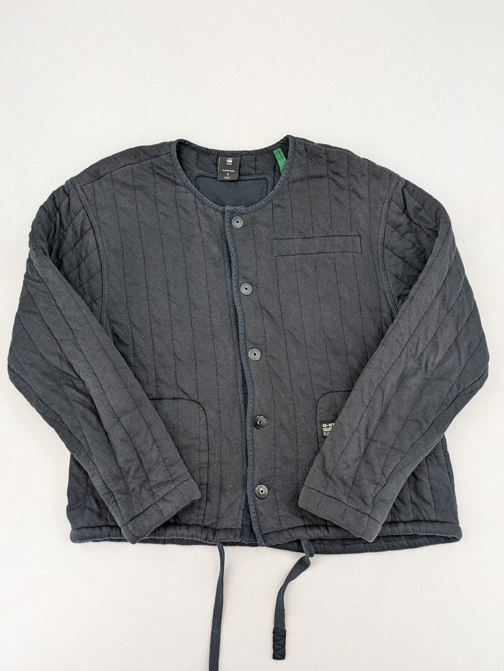 G-Star Raw grey quilted jacket with button closure and adjustable drawstring hem.