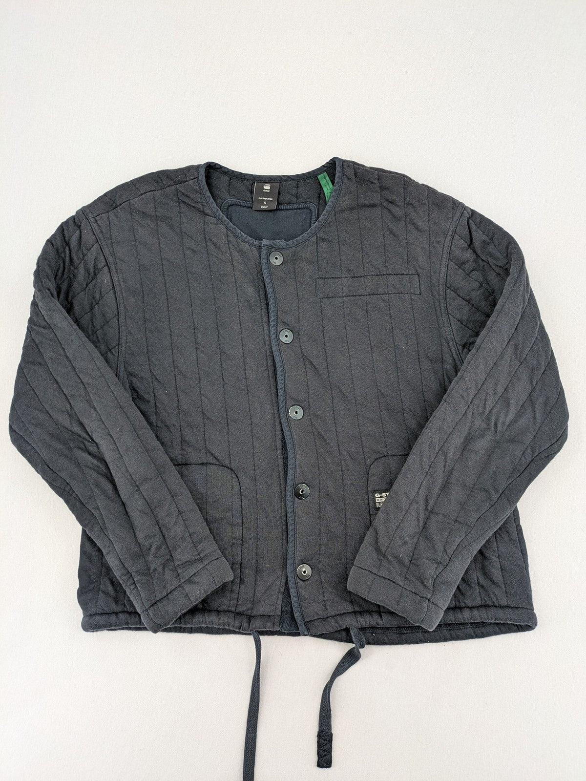 G-Star Raw grey quilted jacket with button closure and adjustable drawstring hem.