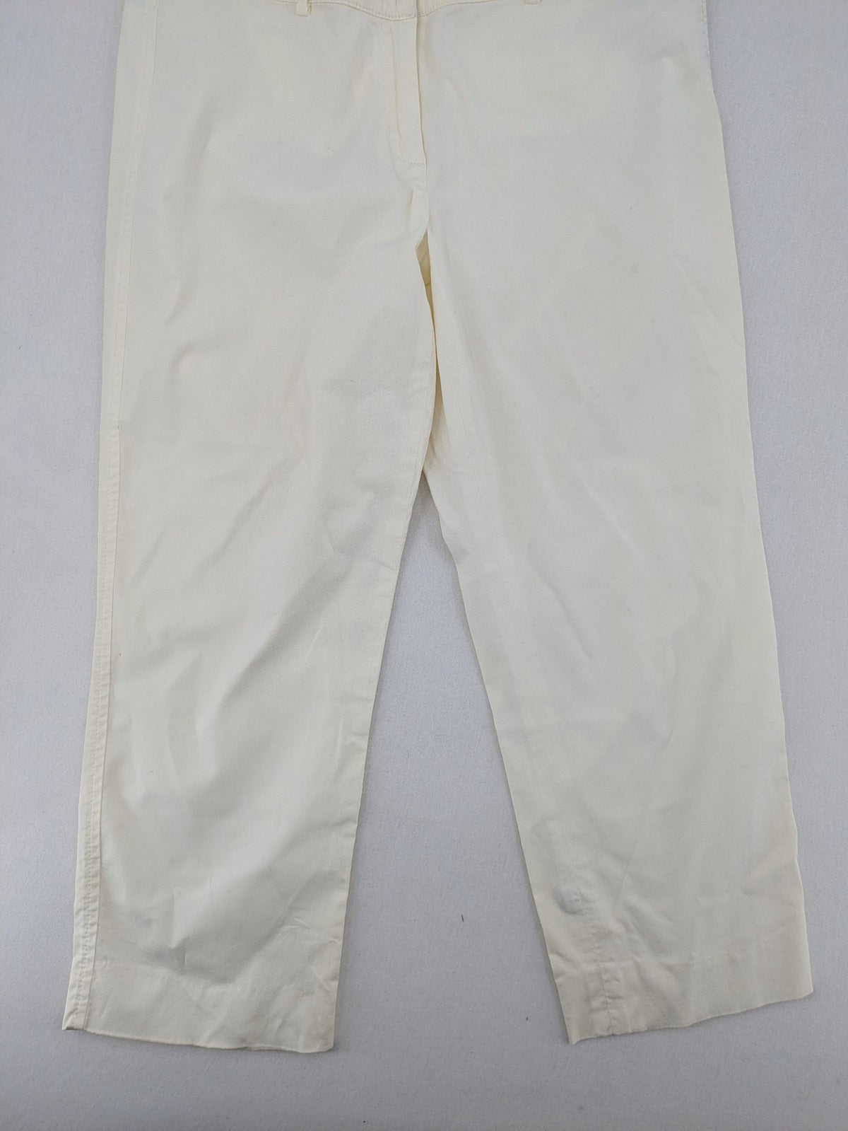 MaxMara cream cropped chino pants with zipper closure, belt loops, and back pockets.