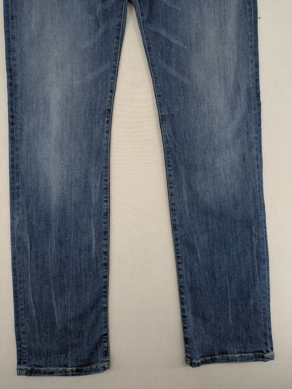 Drykorn blue straight jeans with stretch denim, classic fit, and logo patch on waistband.