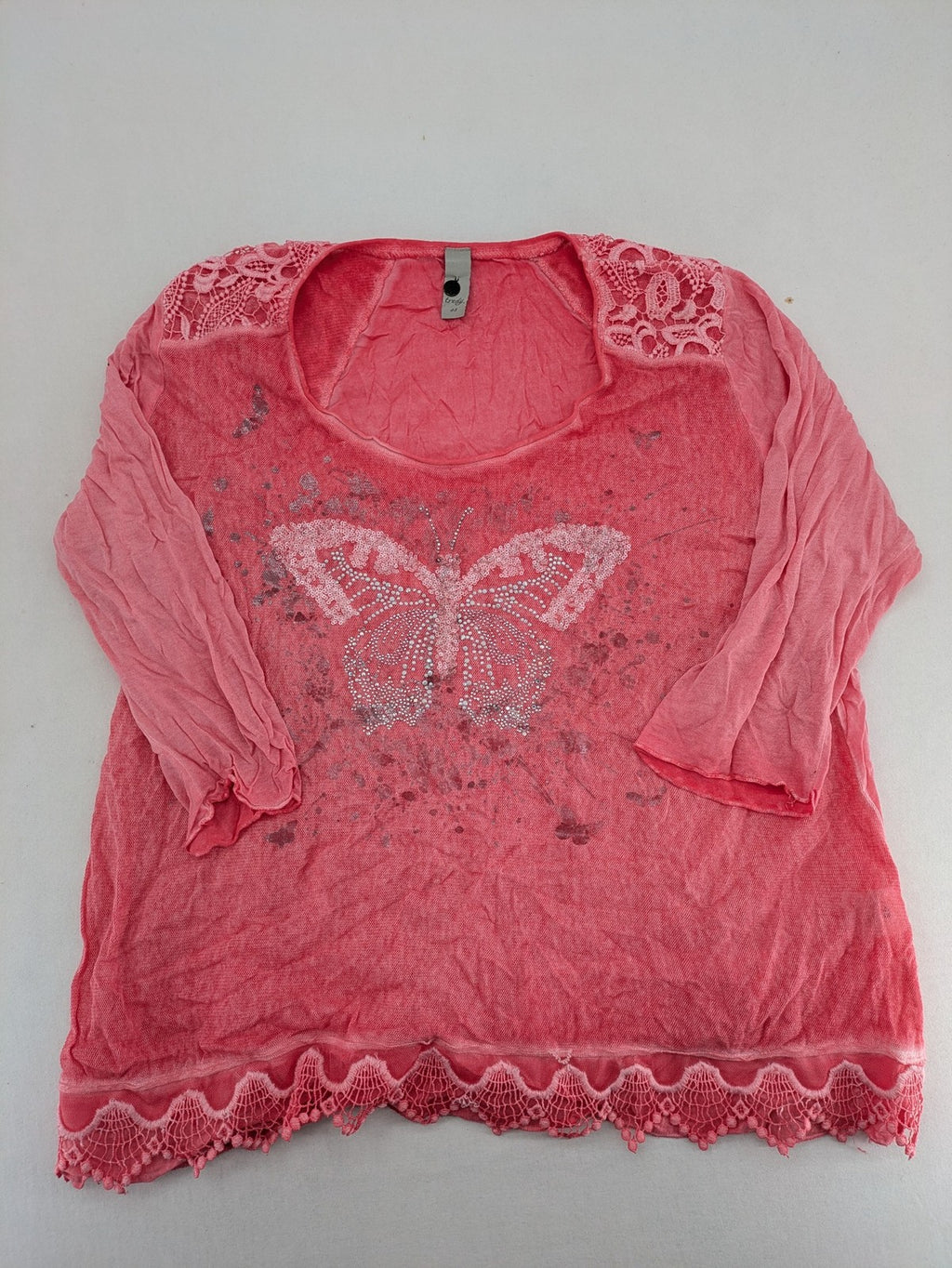 TREDY pink top with butterfly graphic, embellished with rhinestones and lace accents.