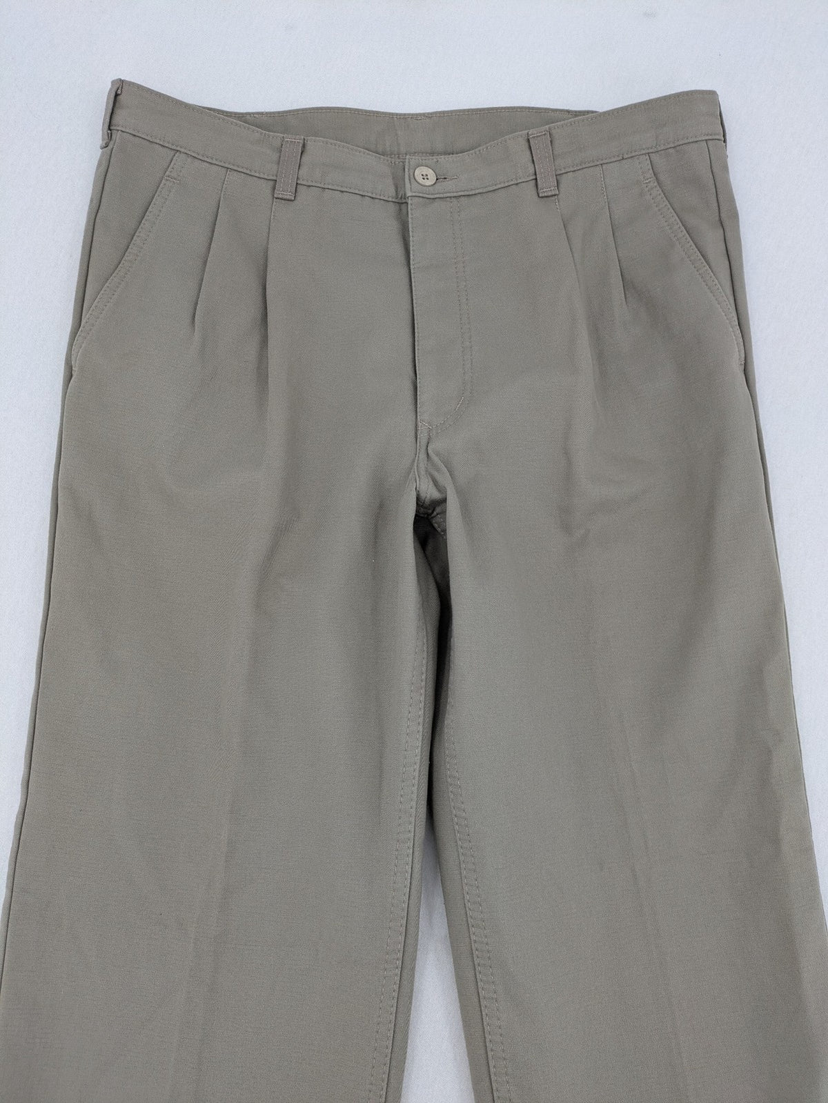 Pioneer beige chino trousers with pleats, straight leg, and buttoned back pocket.