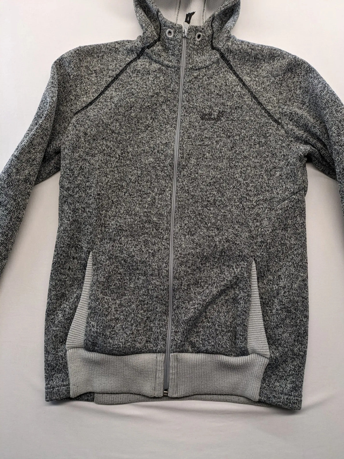 Jack Wolfskin grey fleece jacket with logo detailing and two front pockets.