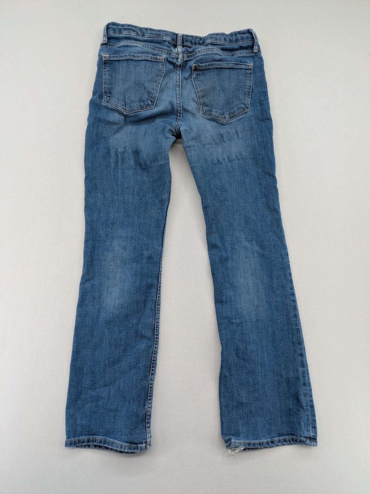 H&M blue bootcut jeans size 146, medium wash, stretch denim material.