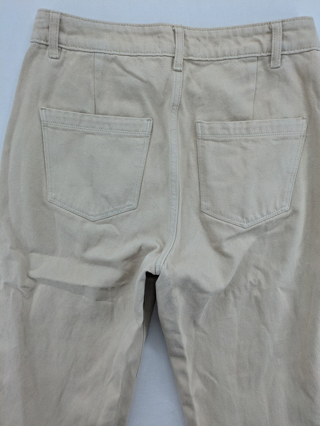 Pimkie beige mom jeans high waist tapered fit with front button placket and cotton material.