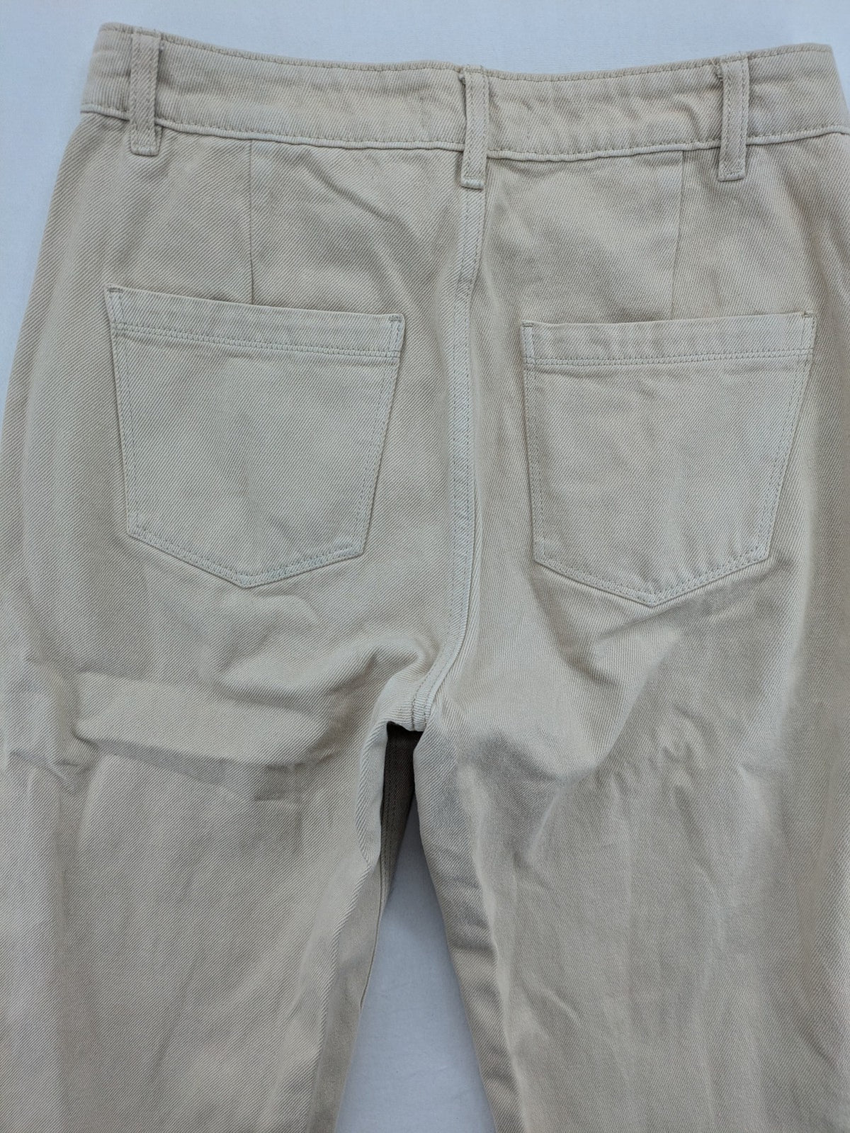 Pimkie beige mom jeans high waist tapered fit with front button placket and cotton material.