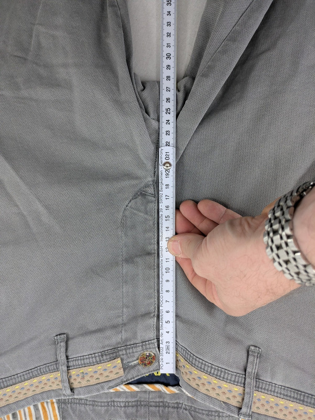 MMX grey chino pants with patterned interior lining and contrasting waistband, made from organic cotton.