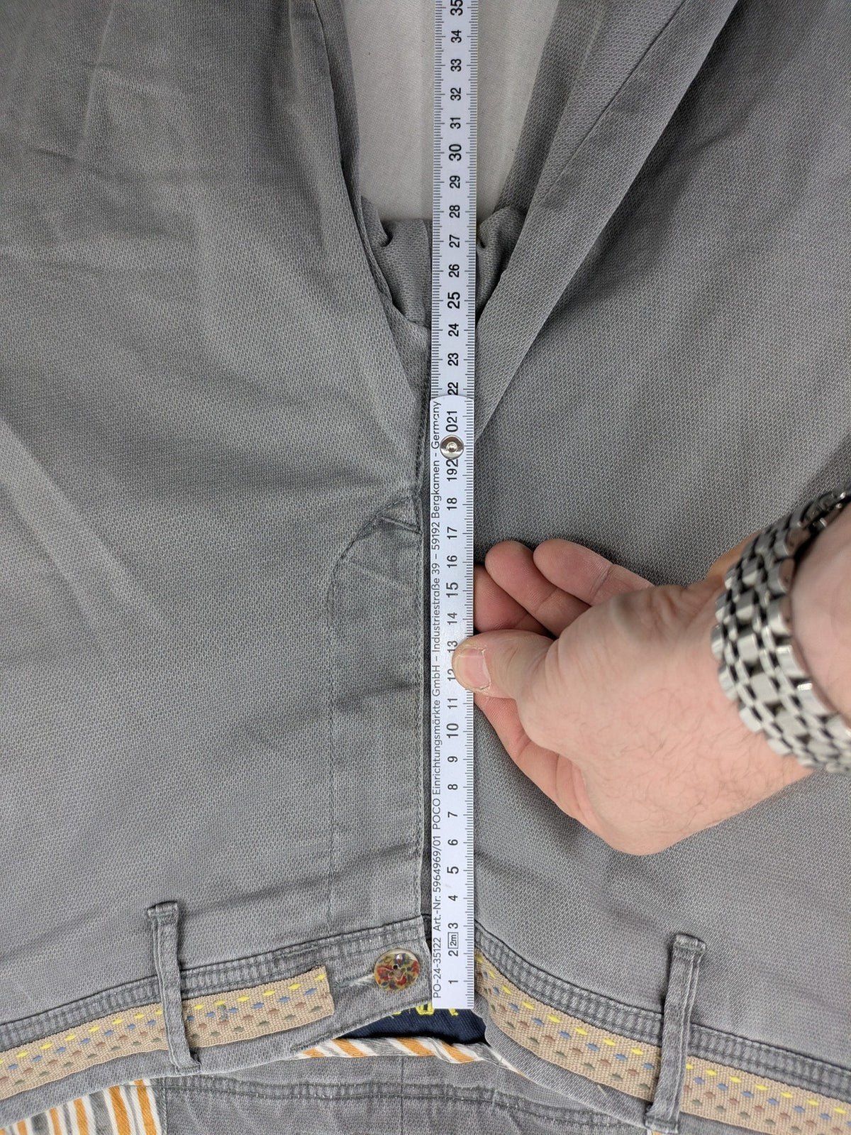 MMX grey chino pants with patterned interior lining and contrasting waistband, made from organic cotton.