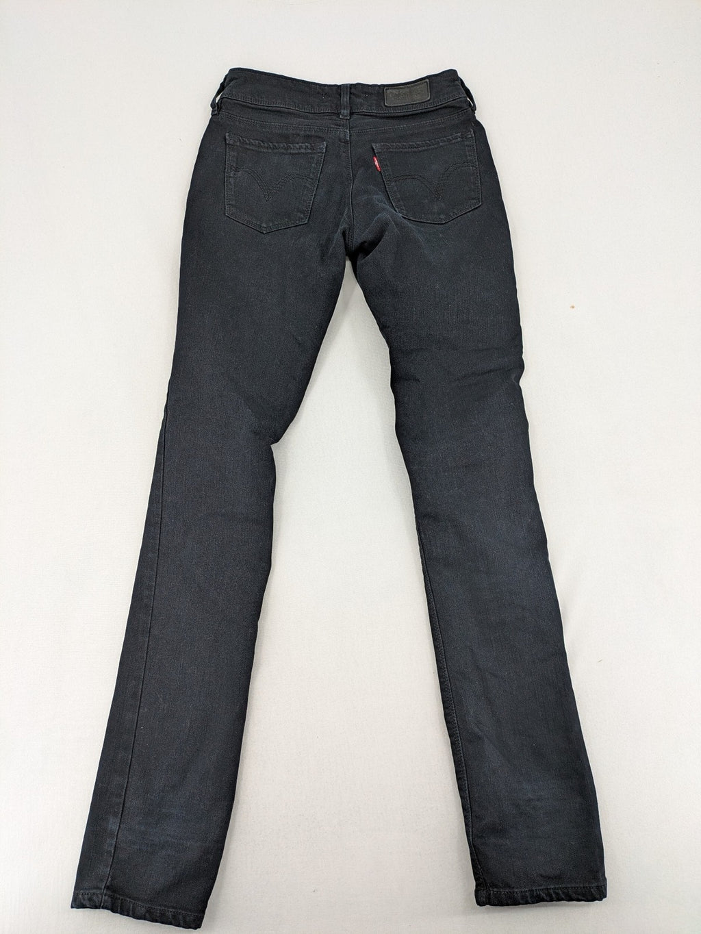 Levi's black slim fit jeans with classic 5-pocket design and zipper fly.