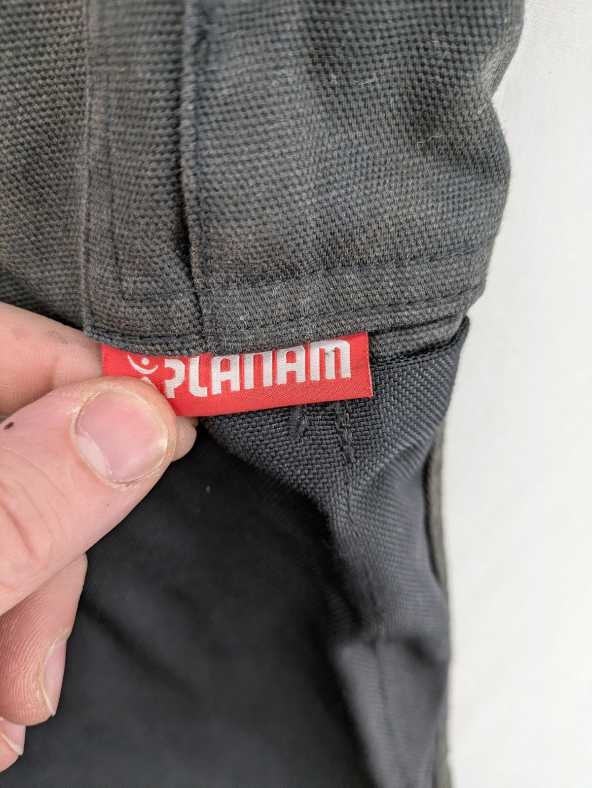 Planam work trousers black canvas with Cordura knee reinforcement and cargo pockets.