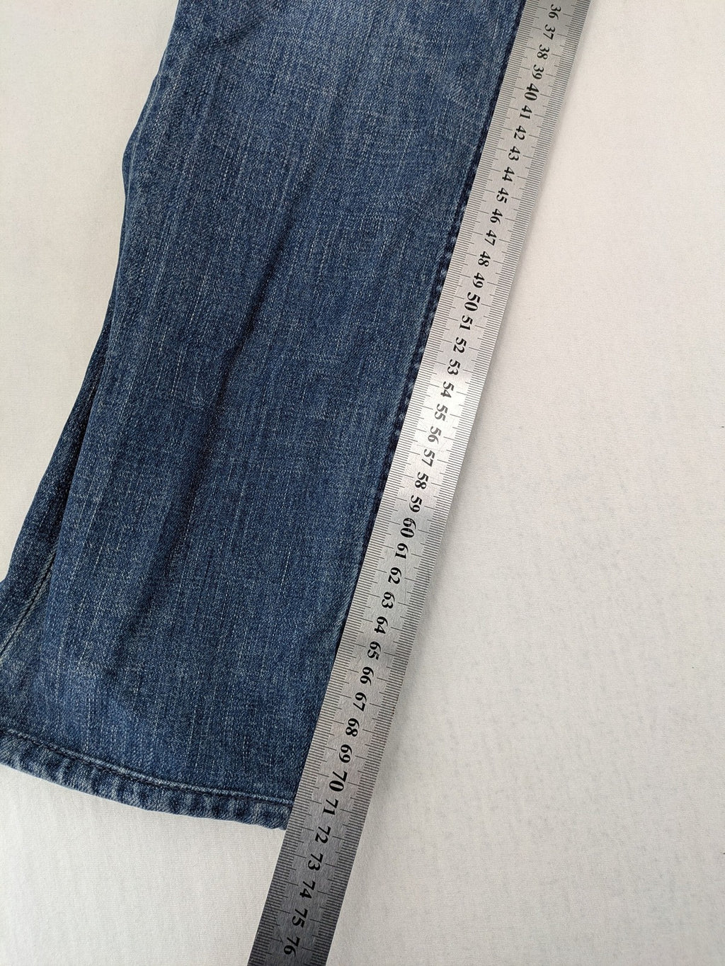 Trussardi blue straight jeans with classic 5-pocket design and durable denim material.