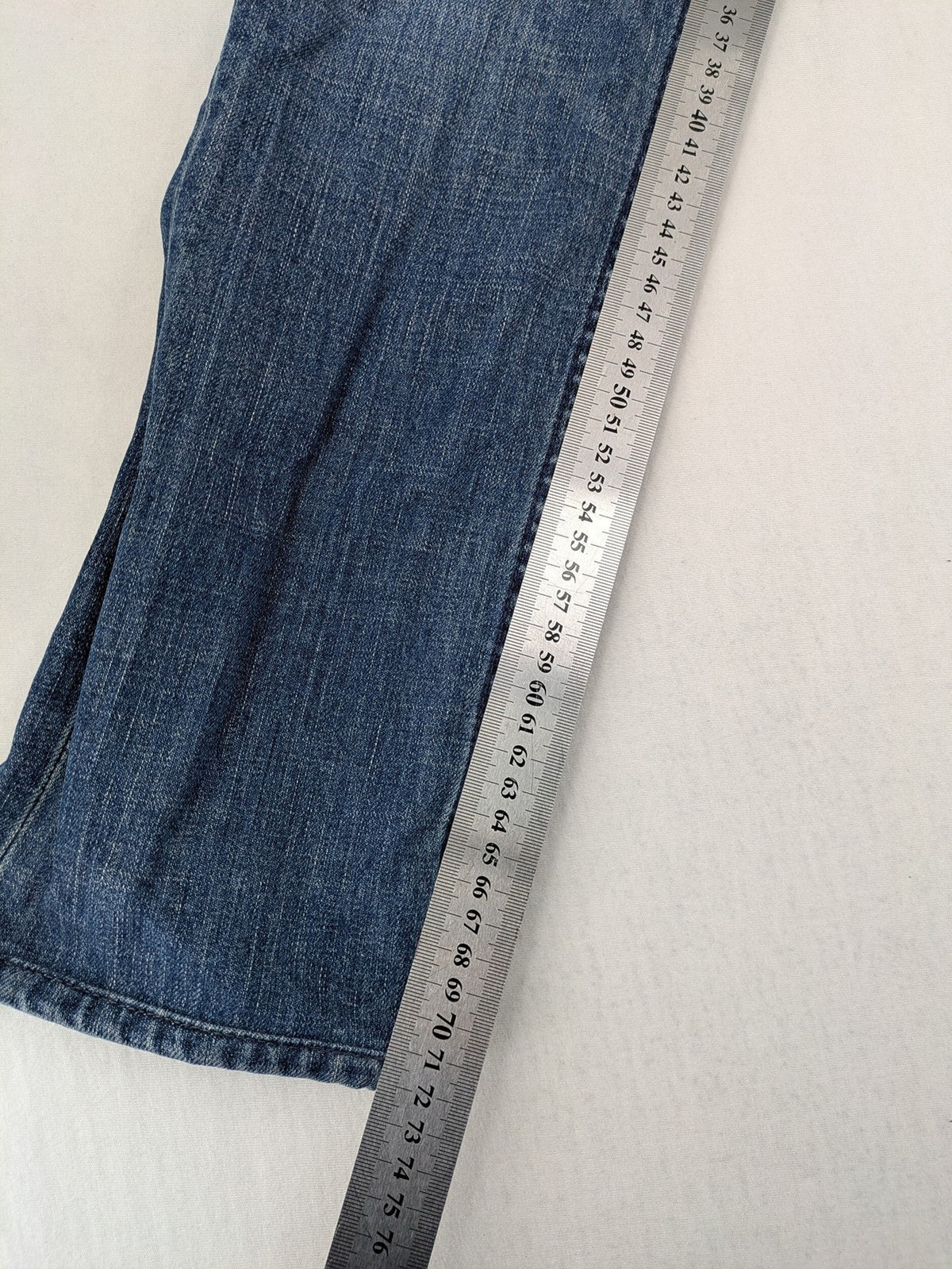 Trussardi blue straight jeans with classic 5-pocket design and durable denim material.
