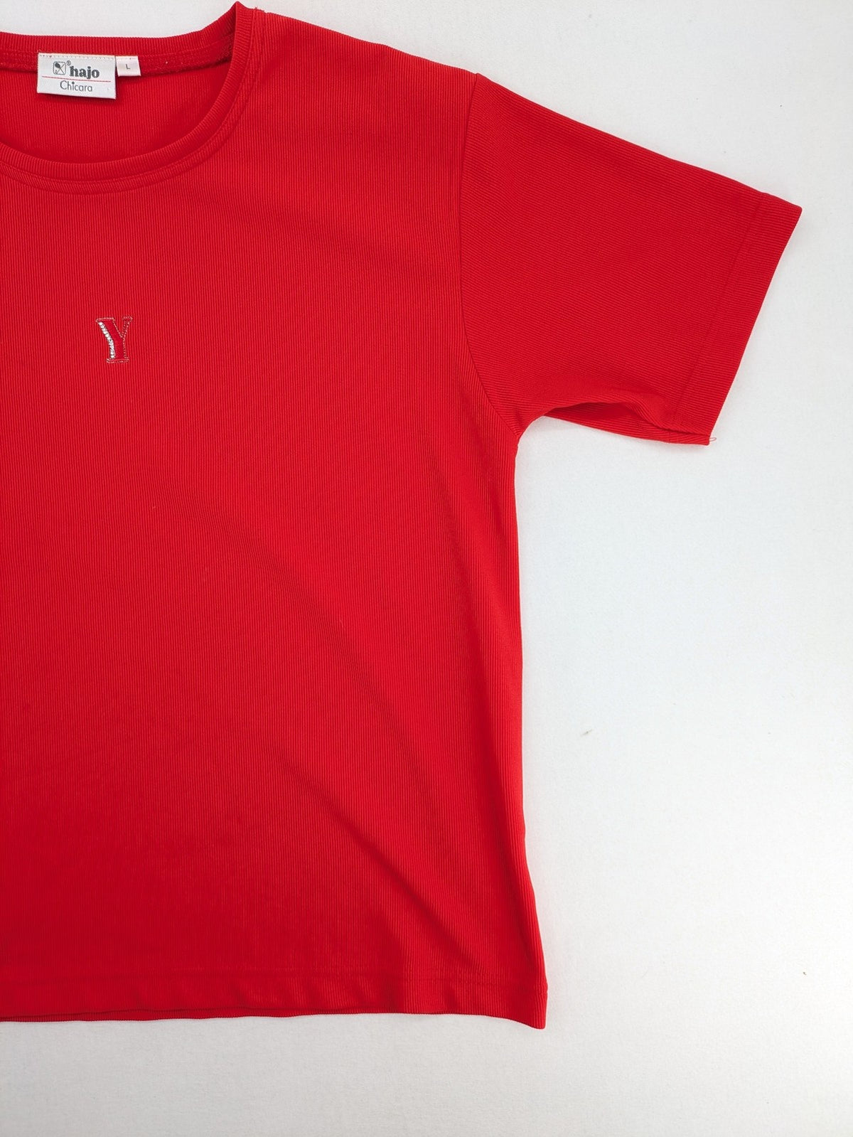 Hajo red t-shirt with ribbed texture and rhinestone Y-logo on chest.