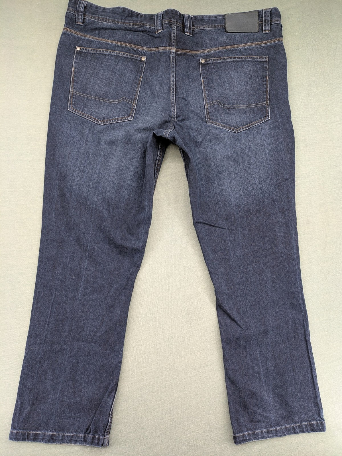 Canda blue straight jeans with five-pocket design and dark wash denim.