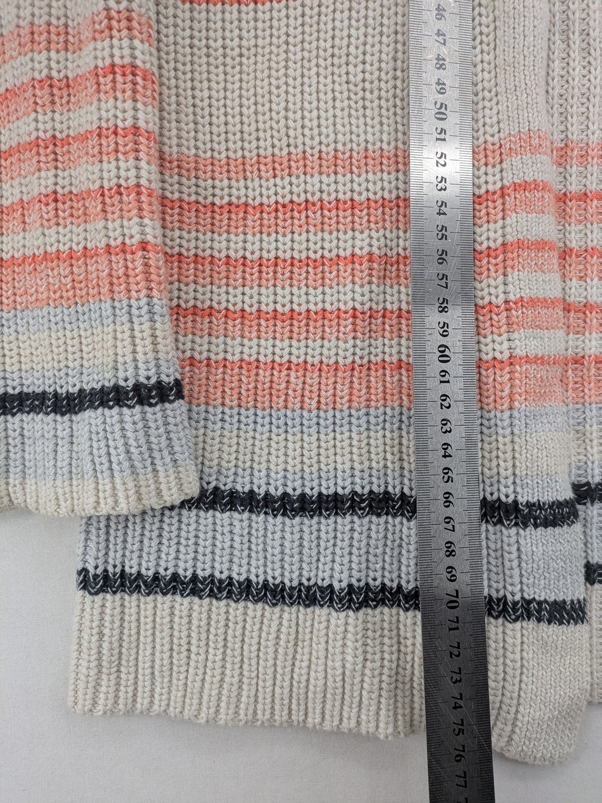 Jonas multi turtle neck jumper with striped pattern and open front design.