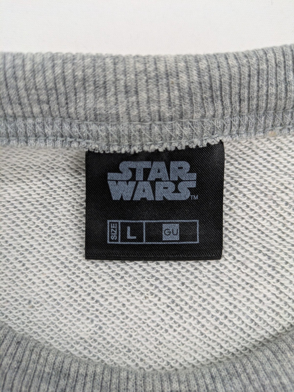 Star Wars grey short-sleeve sweatshirt with large cream logo print on chest.