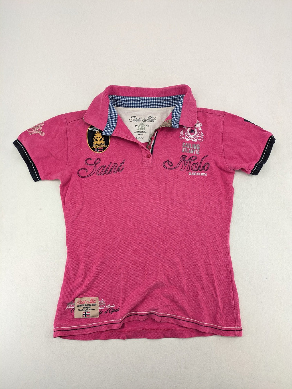 Geographical Norway pink polo shirt with embroidered Saint Malo design and Gingham trim.