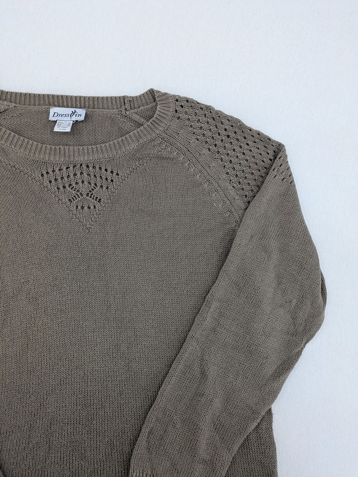 Dressin brown knit jumper with decorative open-knit details and comfortable fit.