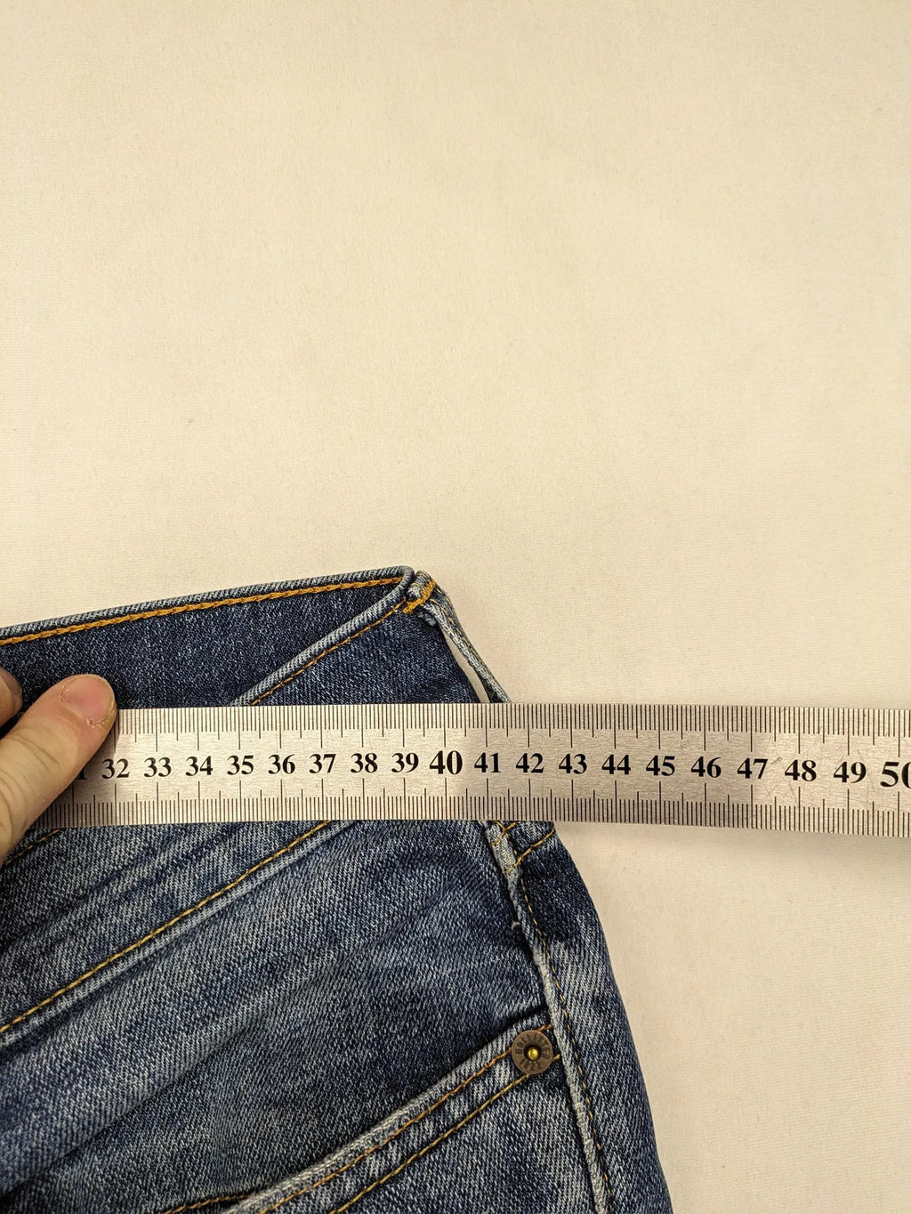 Hollister blue slim fit jeans with distressed detailing and classic button fly.