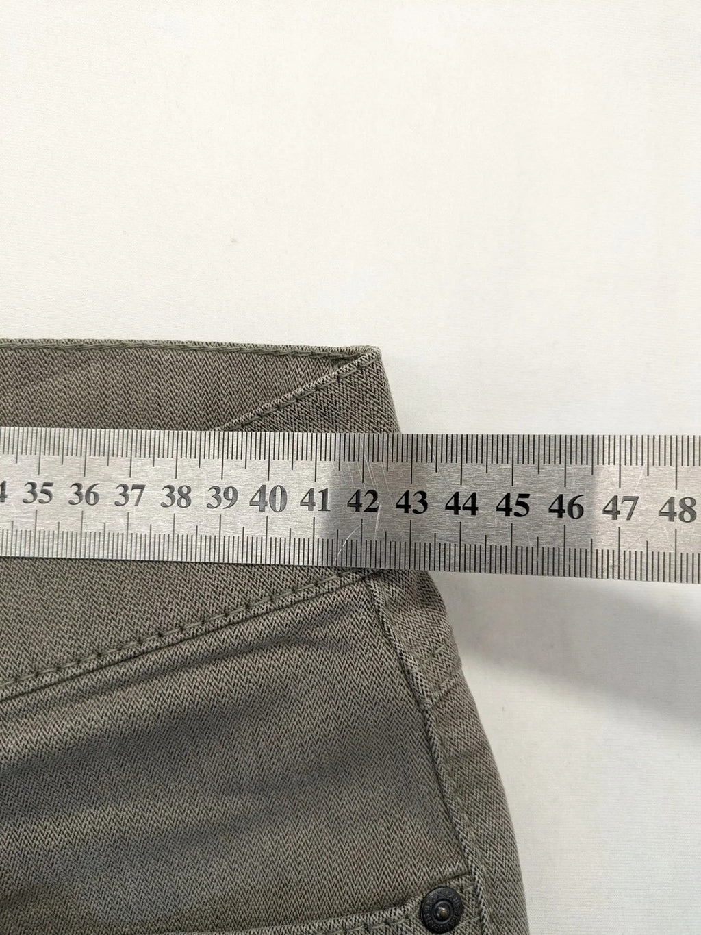 BRAX grey straight jeans 5-pocket design with zipper fly and soft fabric.