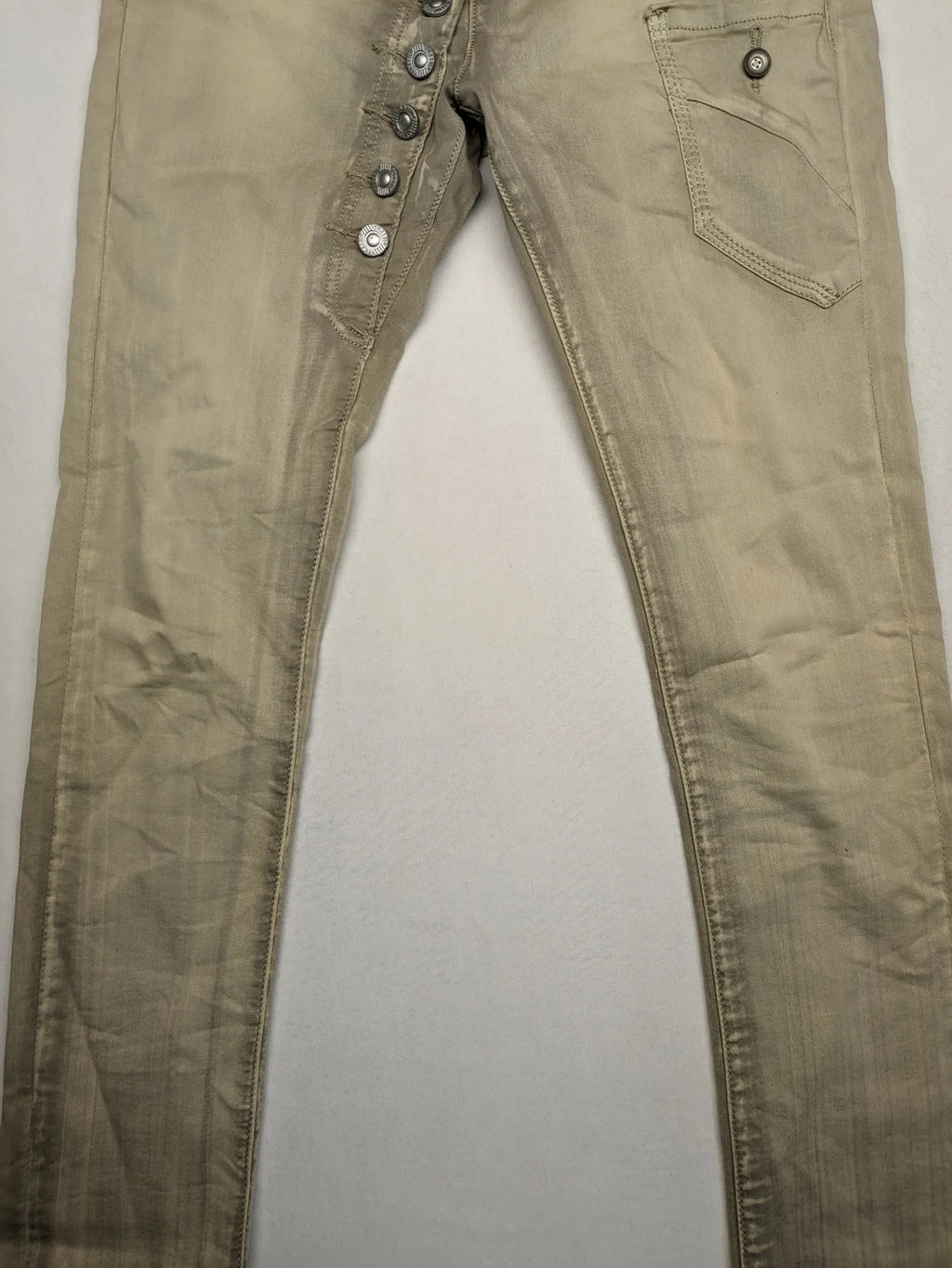 Mozaar beige straight jeans with unique asymmetrical button placket and practical pockets.