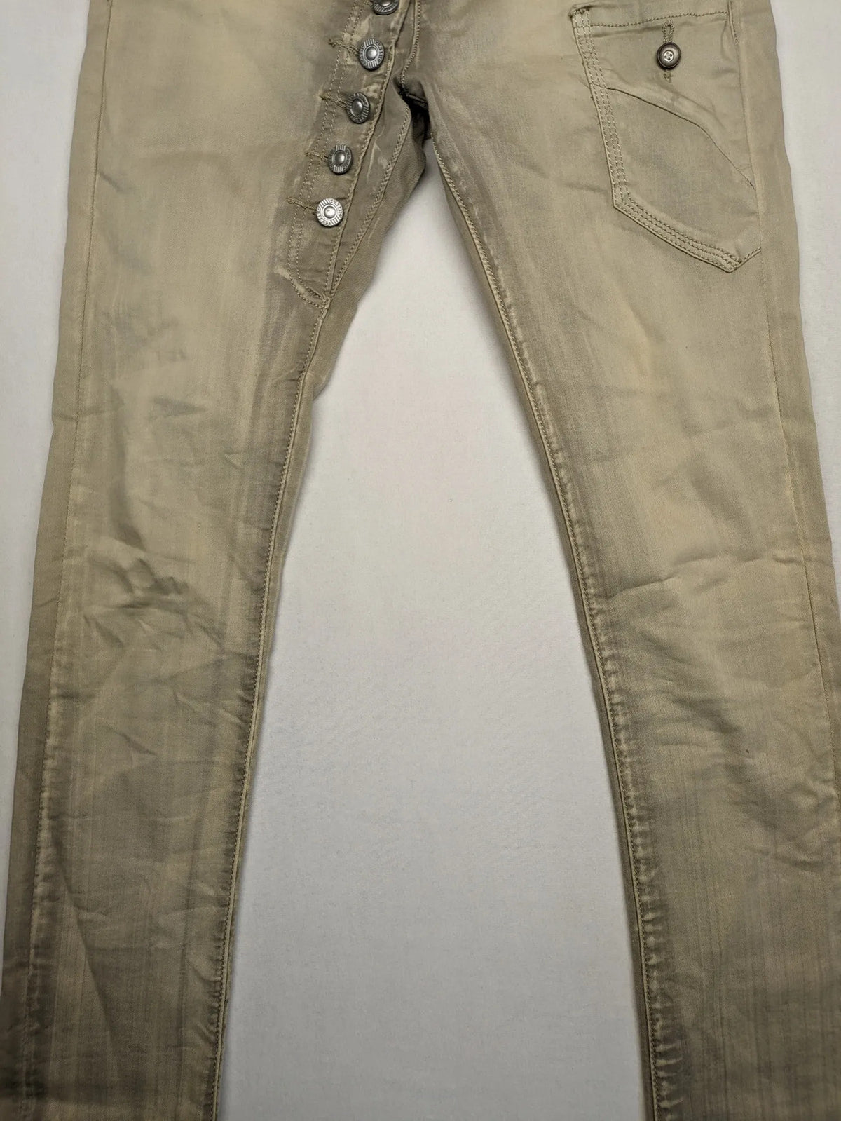 Mozaar beige straight jeans with unique asymmetrical button placket and practical pockets.