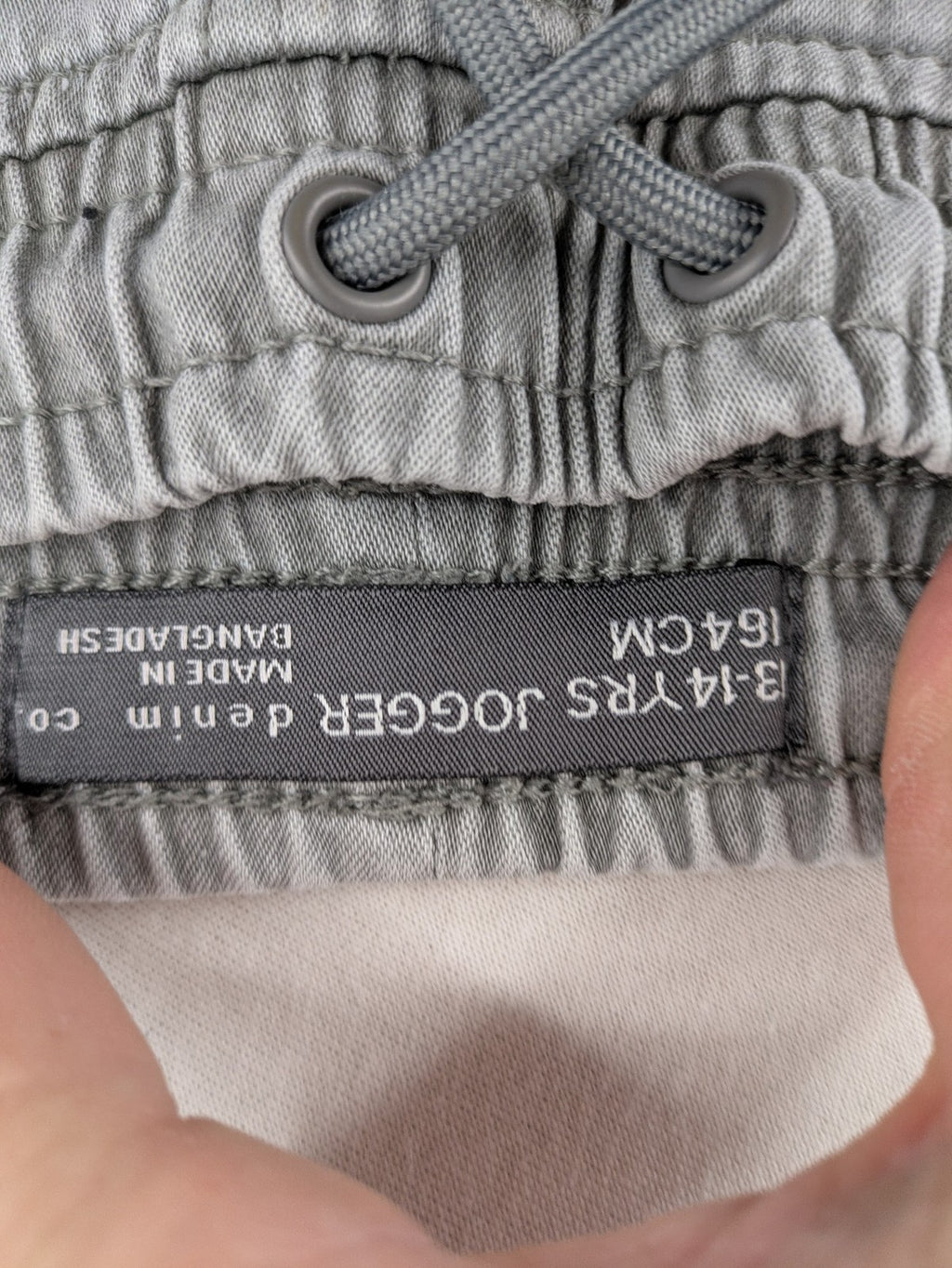 Denim & Co. grey jogger jeans with elastic waistband and ankle cuffs, cotton material.