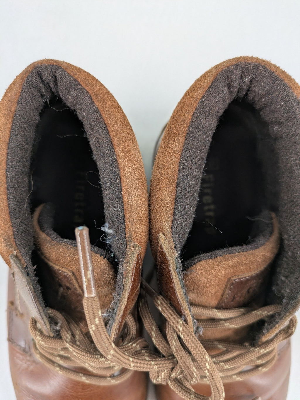 Firetrap brown motorcycle boots with classic lace-up design and padded ankle support.