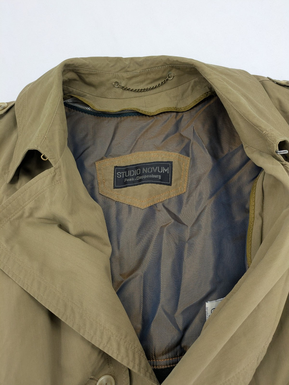 Studio Novum khaki trench coat double-breasted design with belt and wool lining.