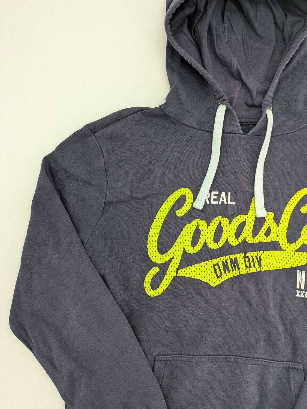 Angelo Litrico grey hoodie with neon green 'Real Goods Co NYC' graphic print and kangaroo pocket.