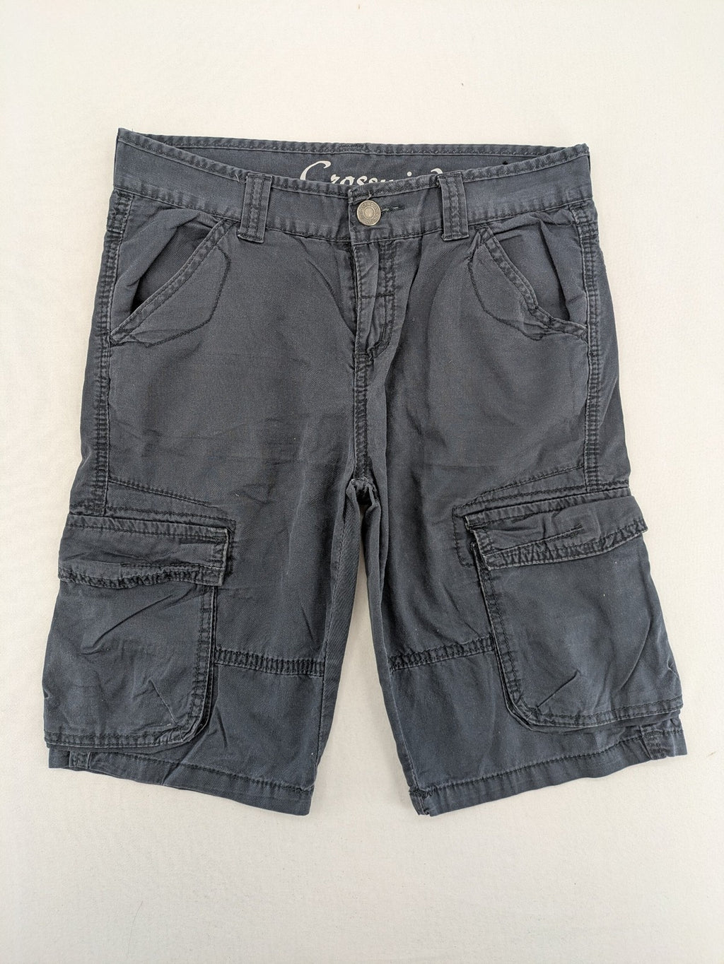 Crosswind grey cargo shorts with multiple pockets and durable cotton material.