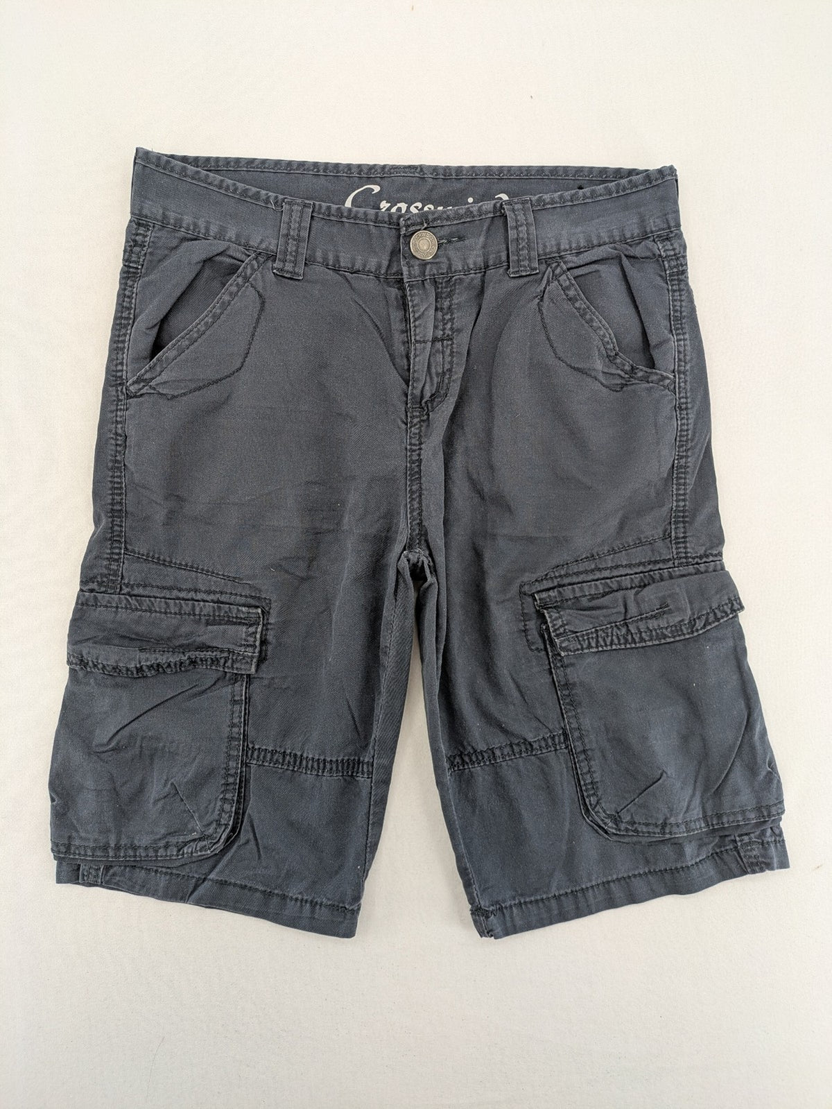 Crosswind grey cargo shorts with multiple pockets and durable cotton material.