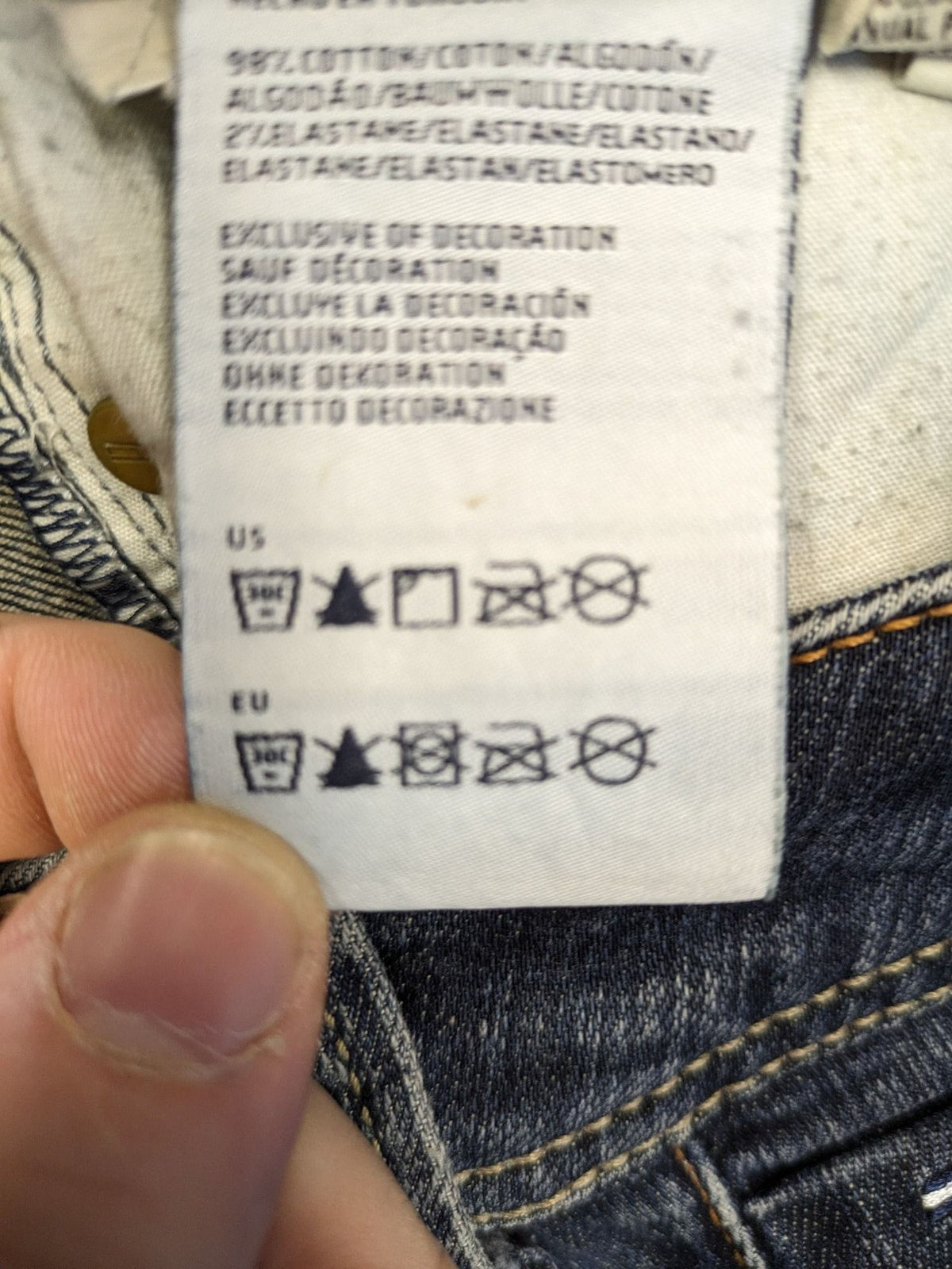 Tommy Hilfiger Denim blue straight jeans with low rise and slight used effects.