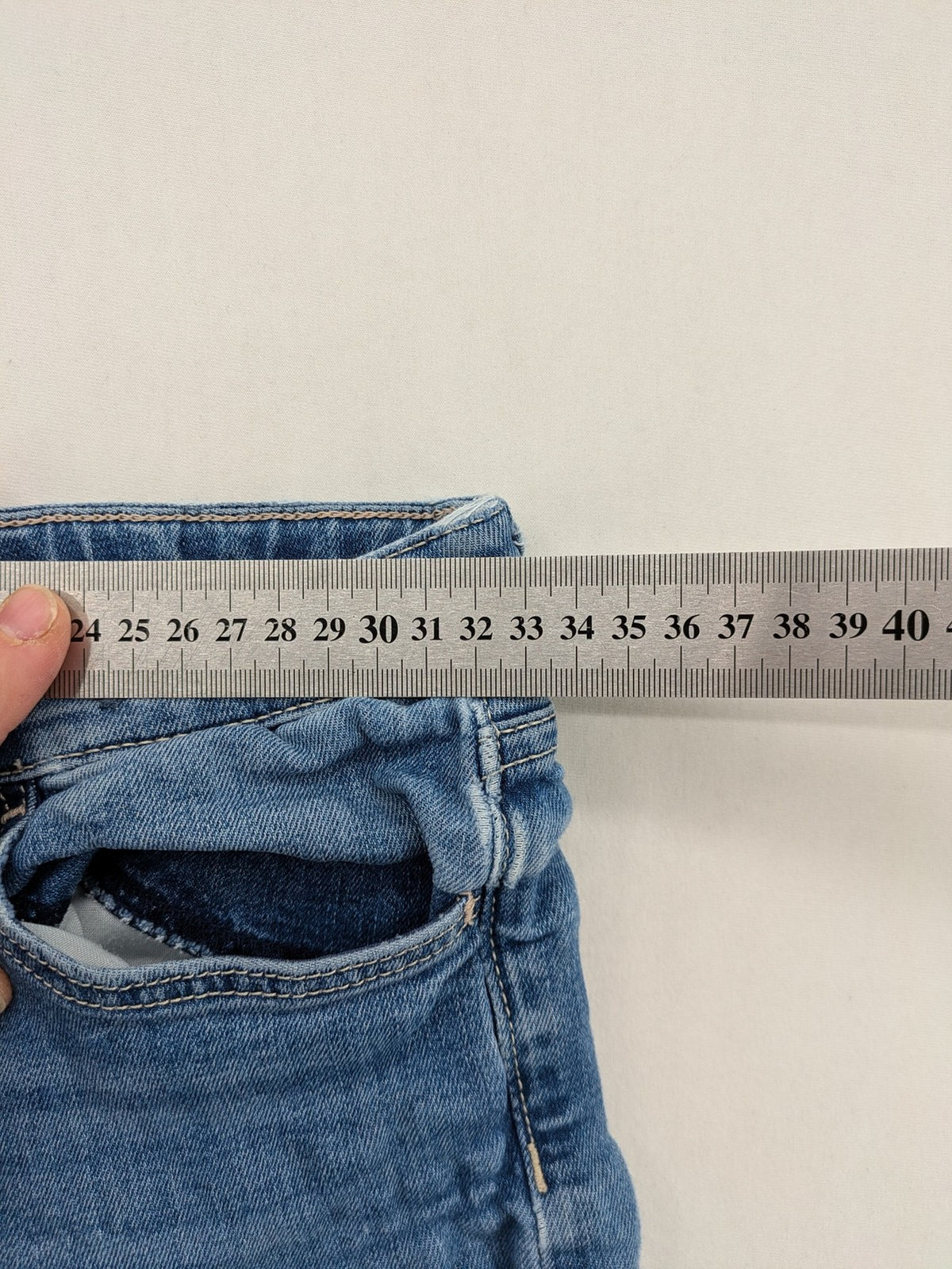 H&M blue bootcut jeans size 146, medium wash, stretch denim material.