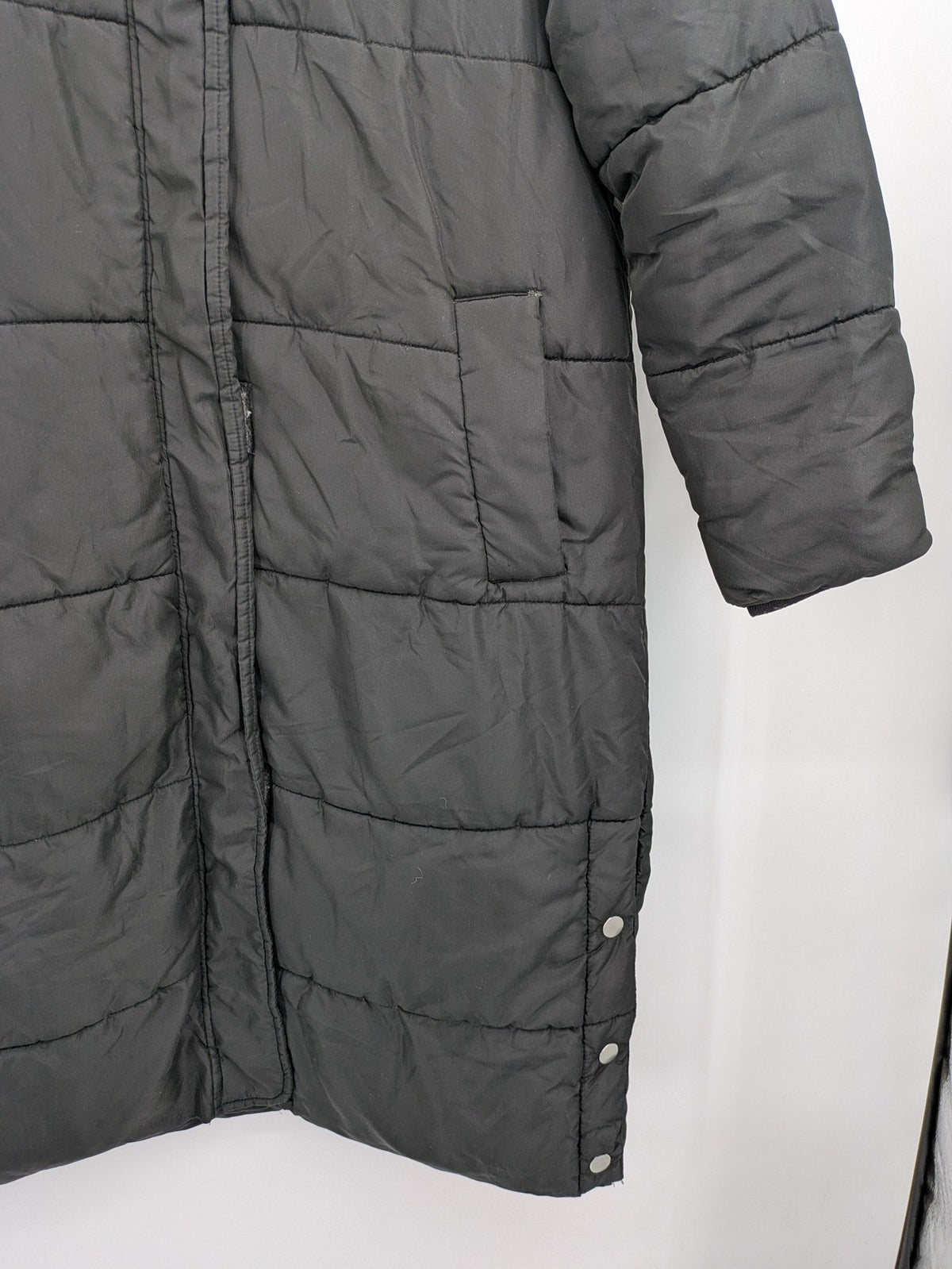 Zeeman grey quilted coat size 38 with hood and side snap buttons.