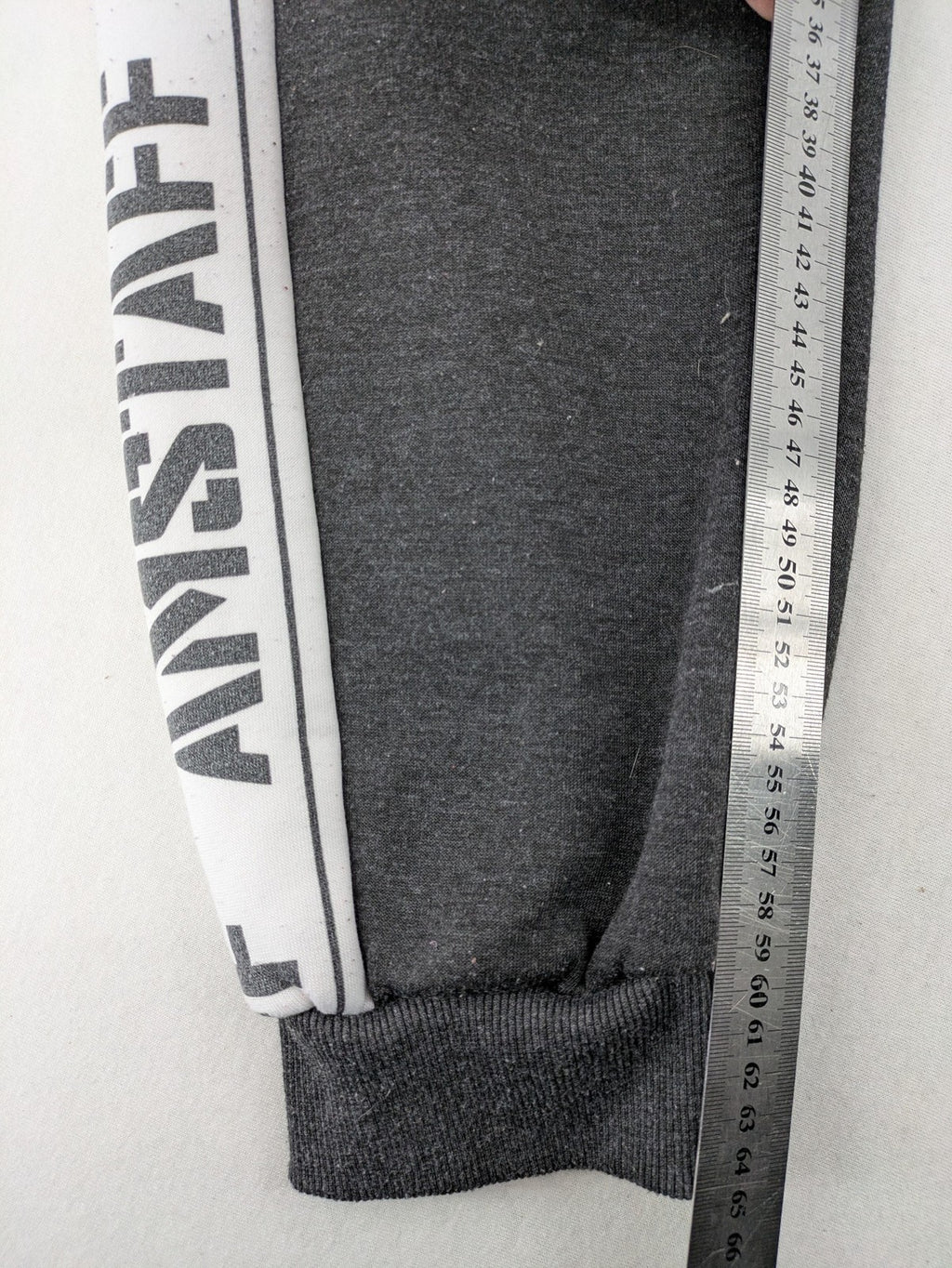 Amstaff grey sweatpants with large dog logo and "Trust & Loyalty" text.