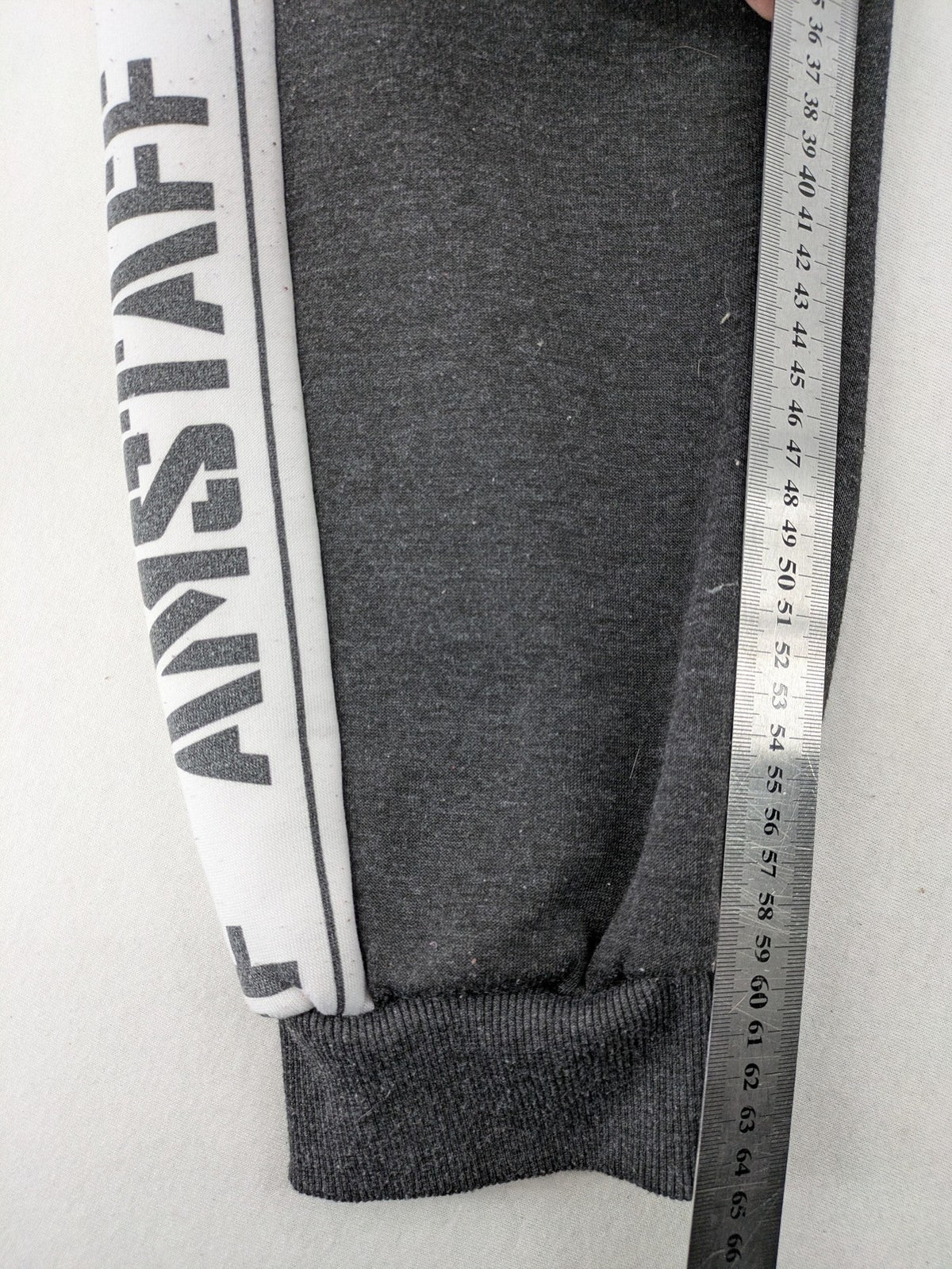 Amstaff grey sweatpants with large dog logo and "Trust & Loyalty" text.