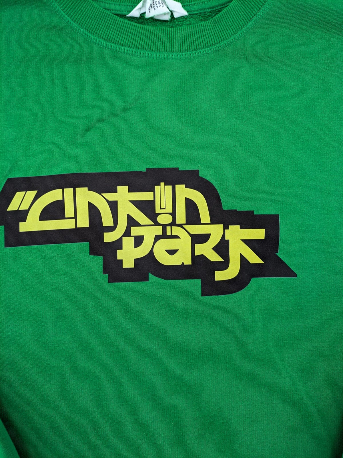 Linkin Park green sweatshirt featuring iconic band logo and classic crew neck design.