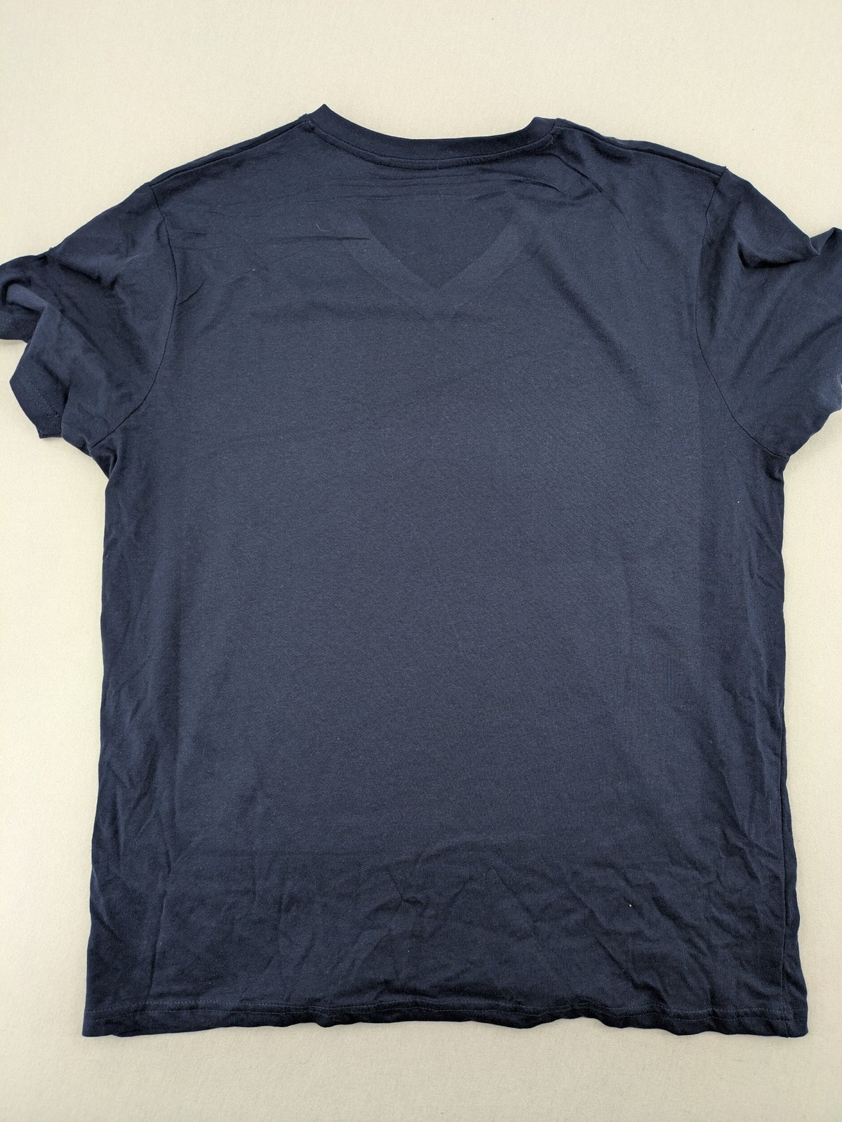 Helloween navy band T-shirt featuring iconic logo and pumpkin graphic, cotton material.