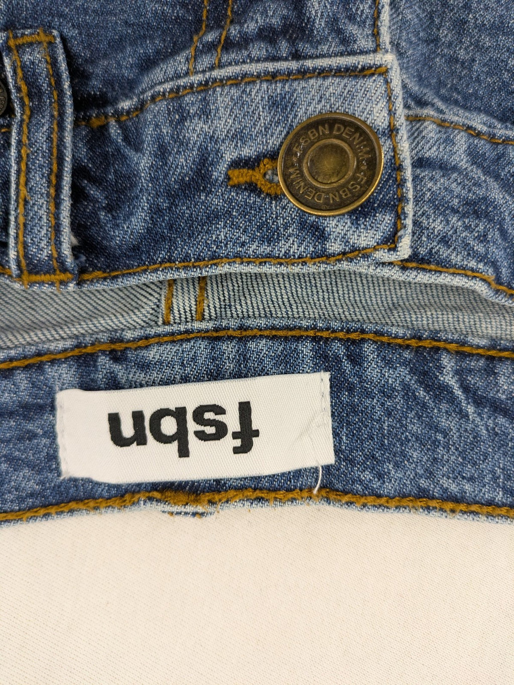 FSBN blue straight jeans with ripped distressed knees and classic button fly.
