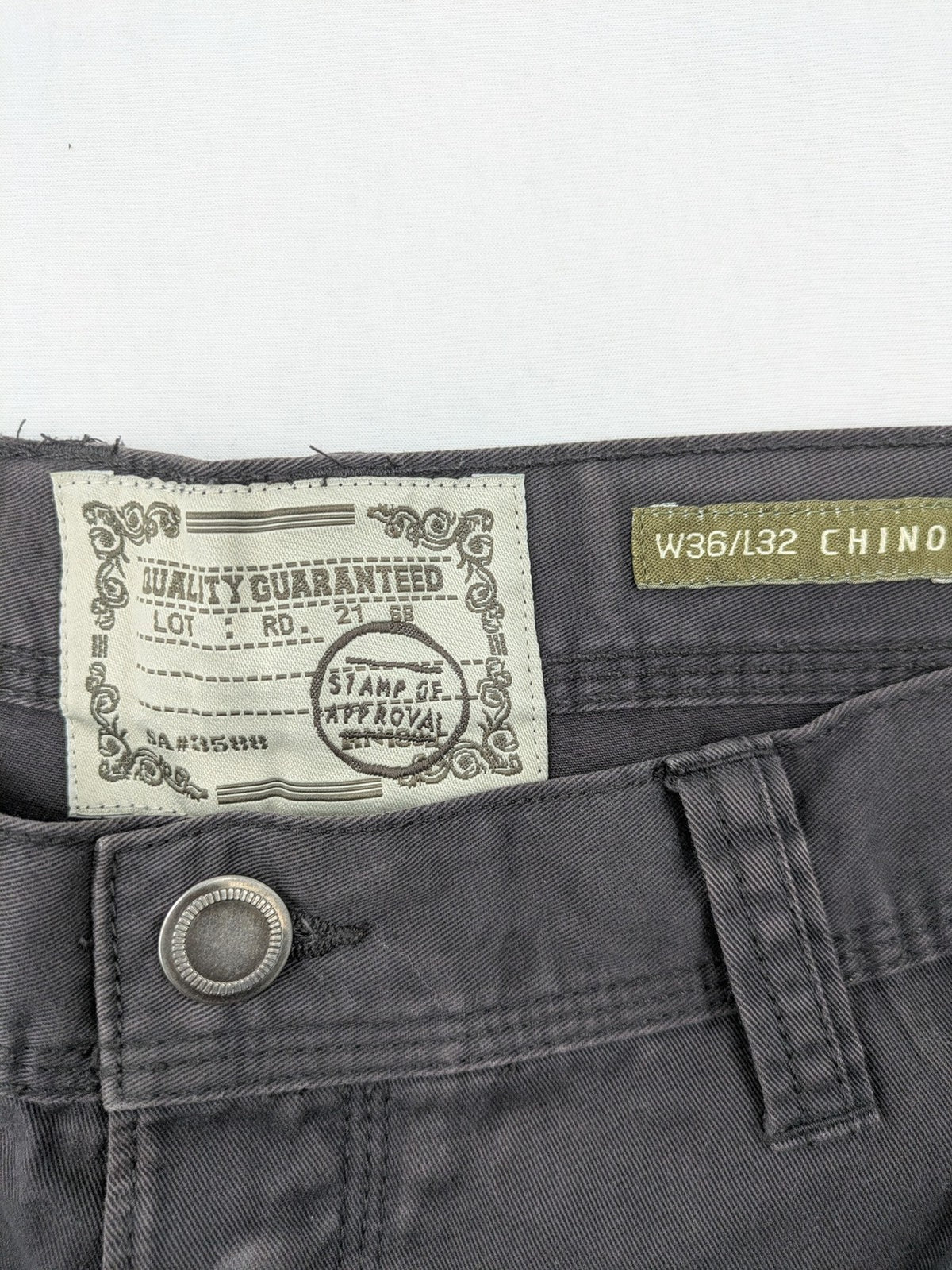 Denim & Co. grey chino pants cotton workwear with button fly and pocket rivets.