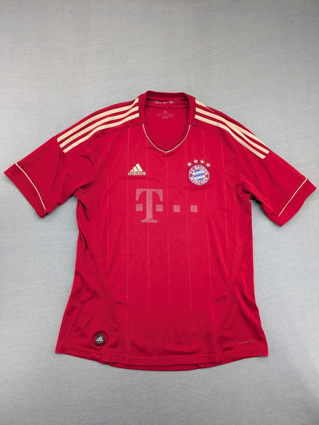 Adidas red soccer uniform with embroidered FC Bayern München crest and T-Mobile logo.