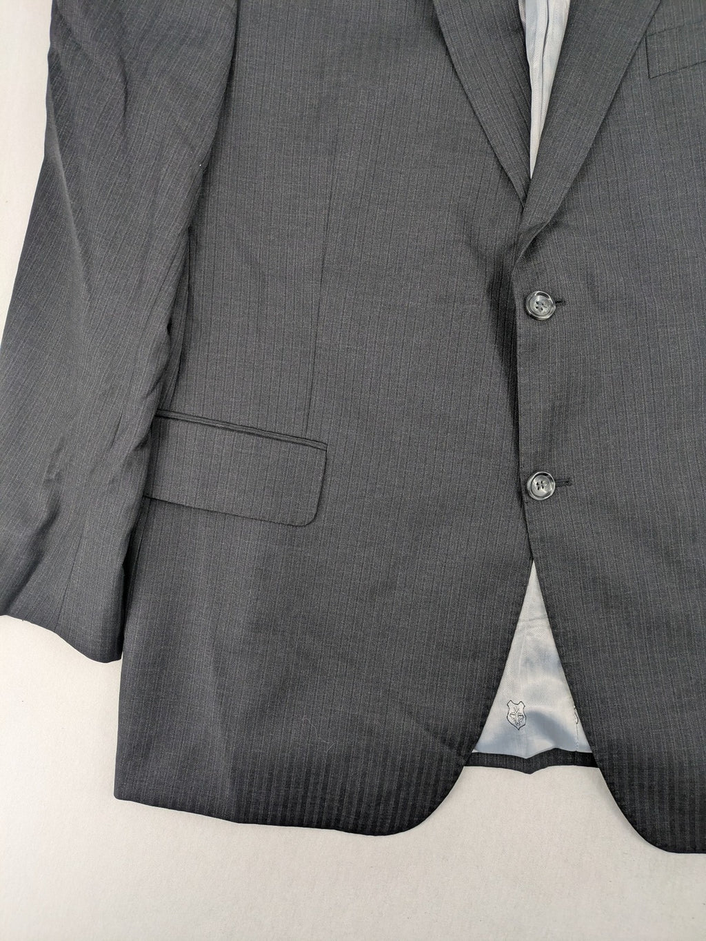 Desch grey blazer with dark grey pinstripe pattern, satin lining, and tailored design.