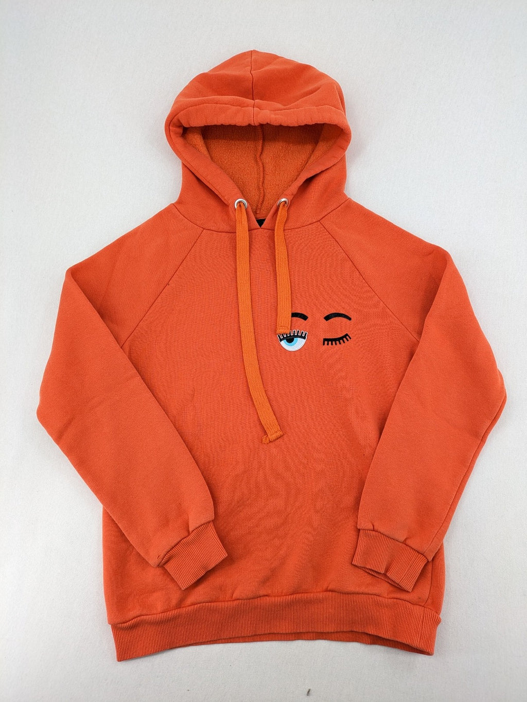 Ginatricot orange hoodie with embroidered winking eye detail, soft material, classic fit.